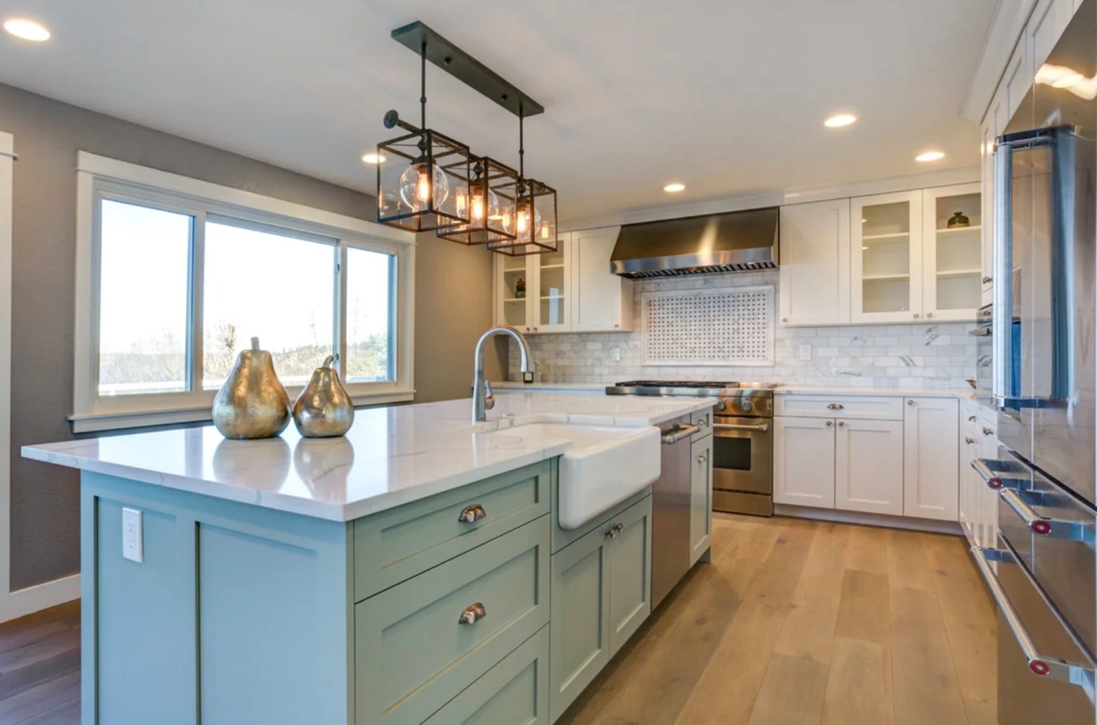 Modern Kitchen with spacious island, farmhouse sink, and elegant lighting